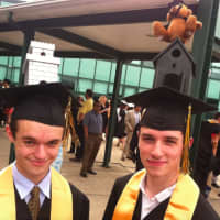 <p>Andrew Baron, left, and Marc Grasso, added some style to their mortarboards.</p>