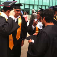 <p>AITE students make some last-minute preparations before the graduation exercises.</p>