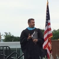 <p>Principal Greg Hatzis takes the stage at the graduation Wednesday at Fairfield Ludlowe High School. </p>
