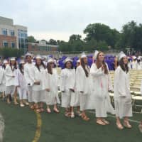 <p>Brien McMahon students file into the football field at the start of the graduation ceremony.</p>