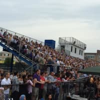 <p>The crowd is assembled in the stands at Taft Field for the Ludlowe graduation. </p>