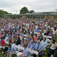 <p>The crowd fills the field at Fairfield Warde for the commencement exercises. </p>
