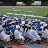 <p>The Class of 2015 settles in on the football field of Danbury High for commencement on Wednesday afternoon. </p>