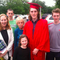 <p>Eamon Cartine is surrounded by family just before the graduation ceremony. From left: mother Kathleen, brother Kevin, 14, grandmother Mary Lynch, sister Julie Ann, 7, and brother Peter, 15. Missing from photo is his father Greg.</p>