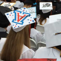 <p>Stamford High graduates show off decorated mortarboards for graduation -- and say goodbye to high school. </p>
