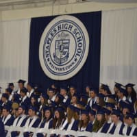 <p>The graduates anxiously wait for the ceremony to begin. </p>