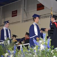 <p>Staples seniors receiving their diplomas. </p>