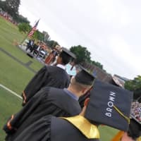 <p>&quot;Brown&quot; walks with his fellow graduates at Stamford High. </p>