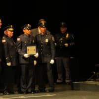 <p>Addison Chavez, center, the newest officer in the Ossining Police Department, is joined by two of his brothers who also are police officers.
</p>