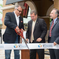 <p>From left, Gillis Poll, Yonkers Mayor Mike Spano and Yonkers Councilman Michael Sabatino cut the ribbon to welcome Angelo&#x27;s to Ridge Hill.</p>