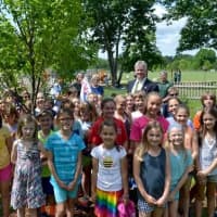 <p>Rep. Shaban and RES second and fourth graders stand by their new tree.</p>