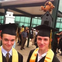 <p>Two AITE graduates show off their highly engineered mortarboards. </p>
