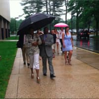<p>Umbrellas are a popular item as the rain forced the Wilton High graduation ceremonies indoors. </p>