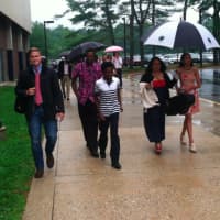 <p>Umbrellas are a popular item as the rain moved the Wilton High graduation ceremonies indoors. </p>