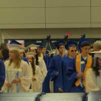 <p>With their diplomas in the foreground, Dobbs Ferry High School seniors file into the gym during the graduate processional on Friday to &quot;Pomp and Circumstance.&quot; </p>