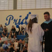 <p>Dobbs Ferry Principal John Falino enjoyed the job of handing out high school diplomas.</p>