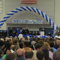 <p>Diplomas are awarded to Dobbs Ferry High School graduates as a packed gym of family and friends look on. </p>