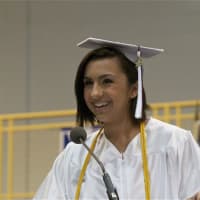 <p>Class of 2015 President Dominique Castro speaks to the crowd at Saturday&#x27;s graduation.</p>