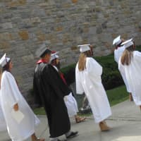 <p>Students excitedly marched from Rye High School on to the turf field for their graduation ceremony. </p>