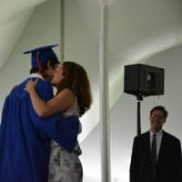 <p>Former Chappaqua school board member Janet Benton hugs her son, Michael as he gets his diploma.</p>