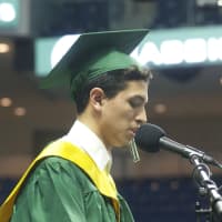 <p>Class of 2015 Valedictorian Rami Kharbouch speaks to the crowd.</p>