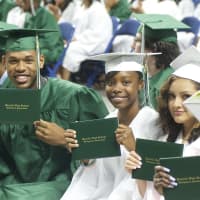 <p>Happy graduates show off their diplomas at Webster Bank Arena as Bassick holds its graduation ceremony. </p>