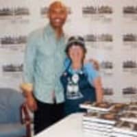 <p>Mariano Rivera, left, greets a fan on May 28 at a benefit for Friend of the New Rochelle Public Library.</p>