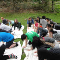 <p>During their visit, students worked with a yoga instructor and learned and
practiced a variety of yoga poses.</p>