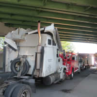 <p>A closeup of the truck&#x27;s cab, which suffered damage to its roof when it hit a Metro-North railroad overpass in Rye on Monday.</p>