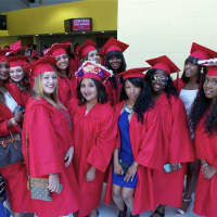 <p>Seniors celebrate as Bridgeport Central High School holds its 2015 commencement ceremony Monday at Webster Bank Arena.</p>