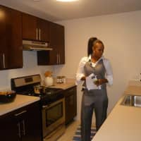 <p>Megan Martin inspects a model apartment in the affordable housing complex unveiled Thursday at 49 N. Broadway. Martin will be one of the tenants in the building when it opens later this fall.</p>