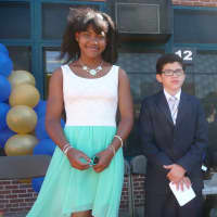 <p>Trinity Elementary School in New Rochelle recently honored its fifth-graders with a moving up graduation ceremony.</p>