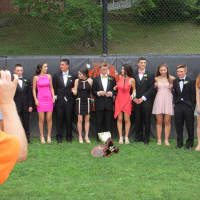 <p>Proud parents snapped photos of prom guests who lined up inside Mamaroneck&#x27;s baseball backstop..</p>