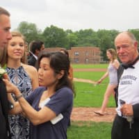 <p>Parents and staff pinned boutonnieres on State Champion baseball players destined for &quot;Chappy Prom.&quot;</p>