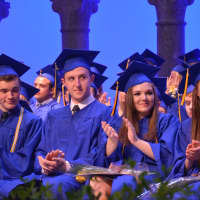 <p>Members of North Salem High School&#x27;s class of 2015 give their applause on stage.</p>