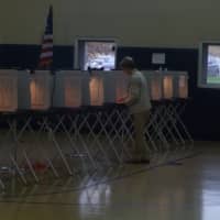 <p>An Easton voter casts her ballot in the special treasurer&#x27;s election.</p>