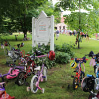 <p>Decorated bikes and trikes of all sizes gather on the Pequot Library&#x27;s Great Lawn after the annual parade from the Five Corners in Southport Village during the 2014 Fourth of July Annual Bike Parade and Lawn Games community event.</p>
