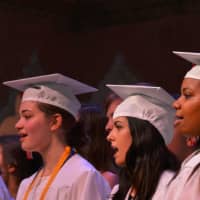 <p>Fox Lane High School graduates participate in a choir performance.</p>