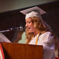 <p>Maria Abrams, a class officer for the class of 2015, serves as master of ceremonies for Fox Lane High School&#x27;s commencement.</p>