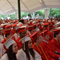 <p>Members of Fox Lane High School&#x27;s class of 2015, in their attire, made up a sea of red and white in the crowd.</p>