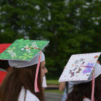 <p>Several Somers High School graduates wore mortarboards with artwork.</p>