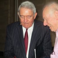 <p>Dan Rather signs his autobiography for Arthur Goldstein of Mamaroneck, who asked Rather about his campaign coverage of former President George W. Bush that led to his being ousted from CBS. Rather spoke at Manhattanville College on Wednesday.</p>