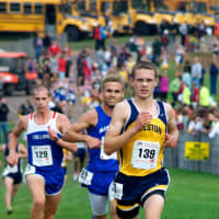 <p>Matt Proctor strides toward the finish line.</p>
