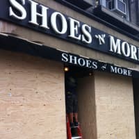 <p>A Greenwich storefront was boarded up Sunday in preparation for Hurricane Sandy.</p>