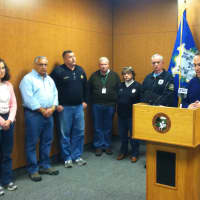 <p>Greenwich First Selectman Peter Tesei, far right, addresses the media regarding Hurricane Sandy on Sunday evening while other town officials look on.</p>