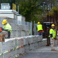 <p>CL&amp;P Crews work to build a six-foot wall around a substation in Stamford&#x27;s South End. </p>