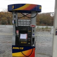 <p>Flooding along Riverside Avenue reaches the Sunoco station Monday afternoon.</p>