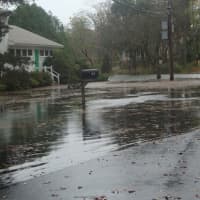 <p>Flooding on Five Mile River Road in Darien Monday morning.</p>