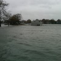 <p>The parking lot of Pear Tree Point Beach in Darien flooded Monday morning.</p>