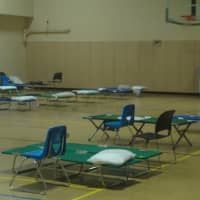 <p>The emergency shelter at Darien High School is equipped with plenty of cots.</p>
